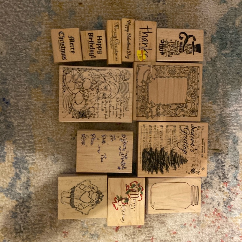 13 rubber stamps mounted to wood